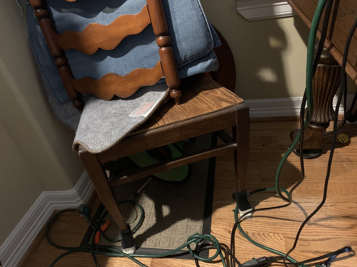 HazelCane's tweet photo. Da hoomin has given me this ramshackle apparatus -- a chair on another chair -- for my high-up snuggle space. It's cozy but I may have to call my union rep - on safety grounds #catsoftwitter #blackcats #cattorney #catalanche https://t.co/0Jd2z8LrNV