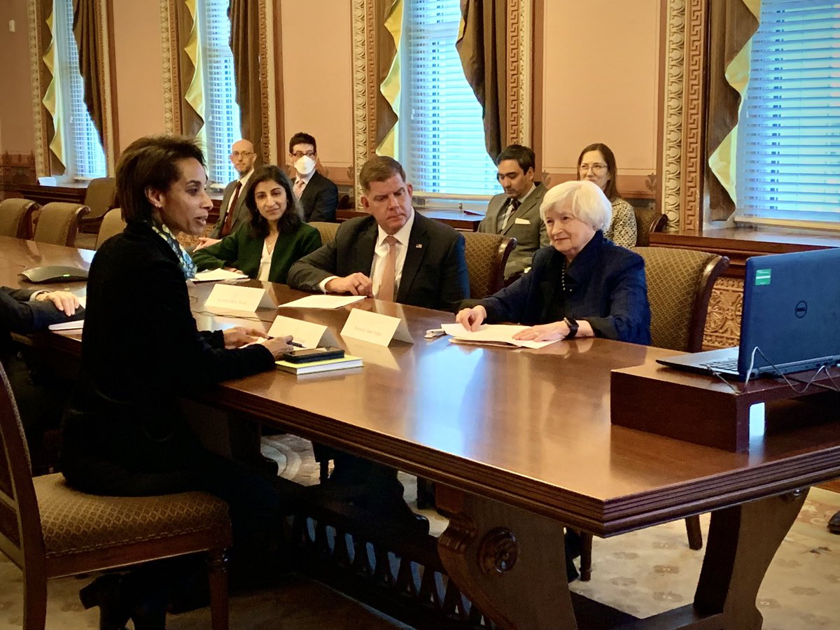 4 people sitting around a table