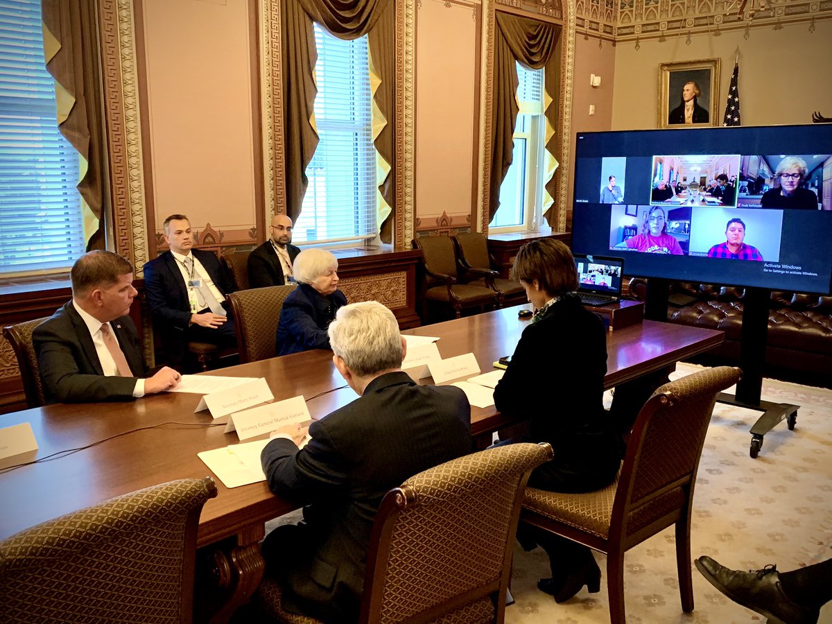 4 people sitting around a table