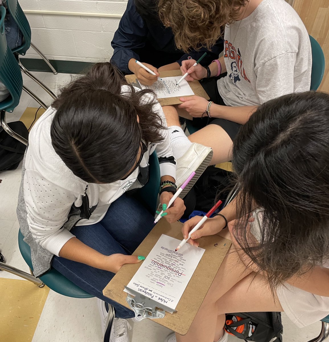 SenoraHaston's tweet photo. It’s musical locura de marzo here at @WoodbridgeHS and we are loving the variety of songs &amp; countries represented. These students raced to highlight lyrics they heard before our daily vote. ¿Quién ganará? @PWCSWorldLang https://t.co/214Uuhrut5