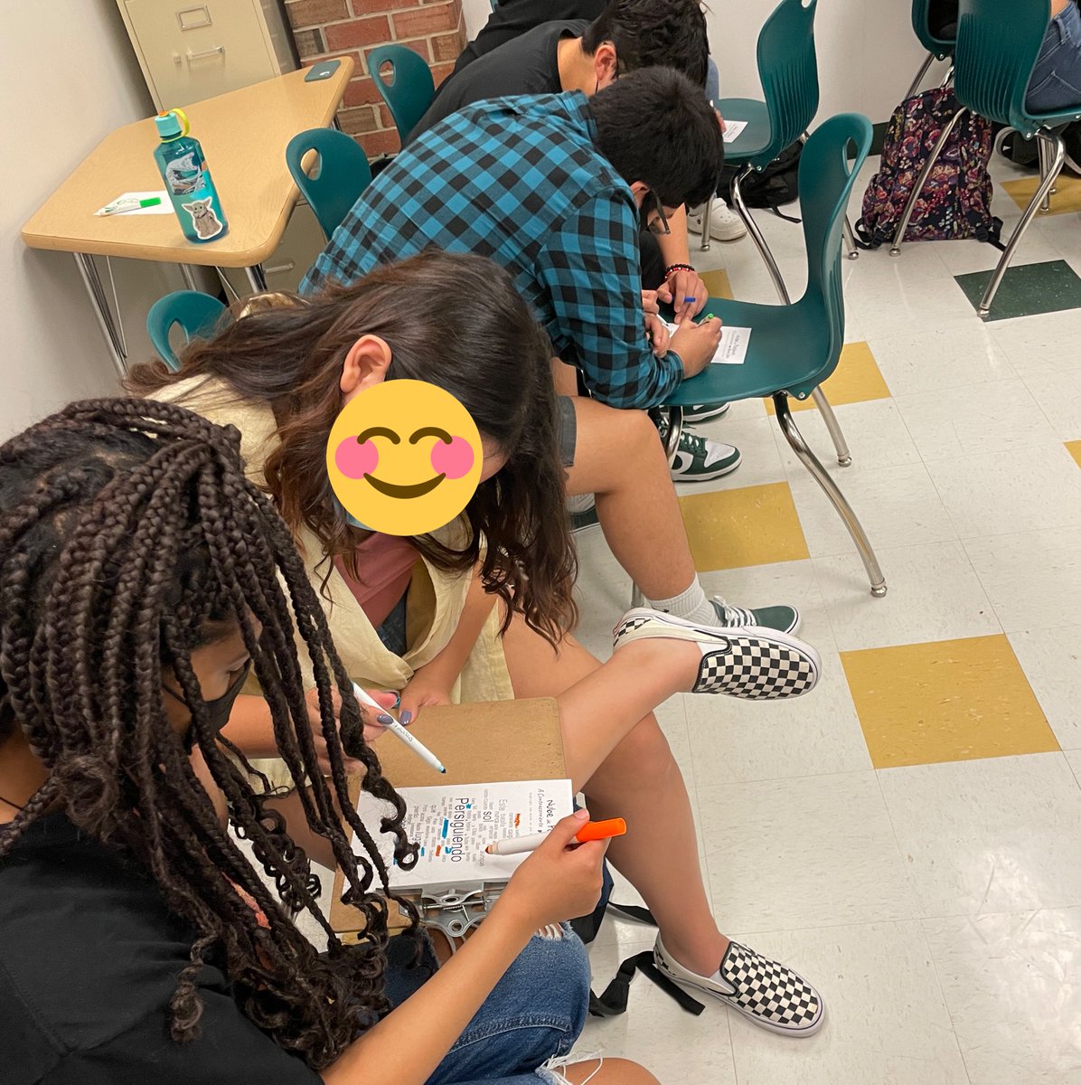 SenoraHaston's tweet photo. It’s musical locura de marzo here at @WoodbridgeHS and we are loving the variety of songs &amp; countries represented. These students raced to highlight lyrics they heard before our daily vote. ¿Quién ganará? @PWCSWorldLang https://t.co/214Uuhrut5