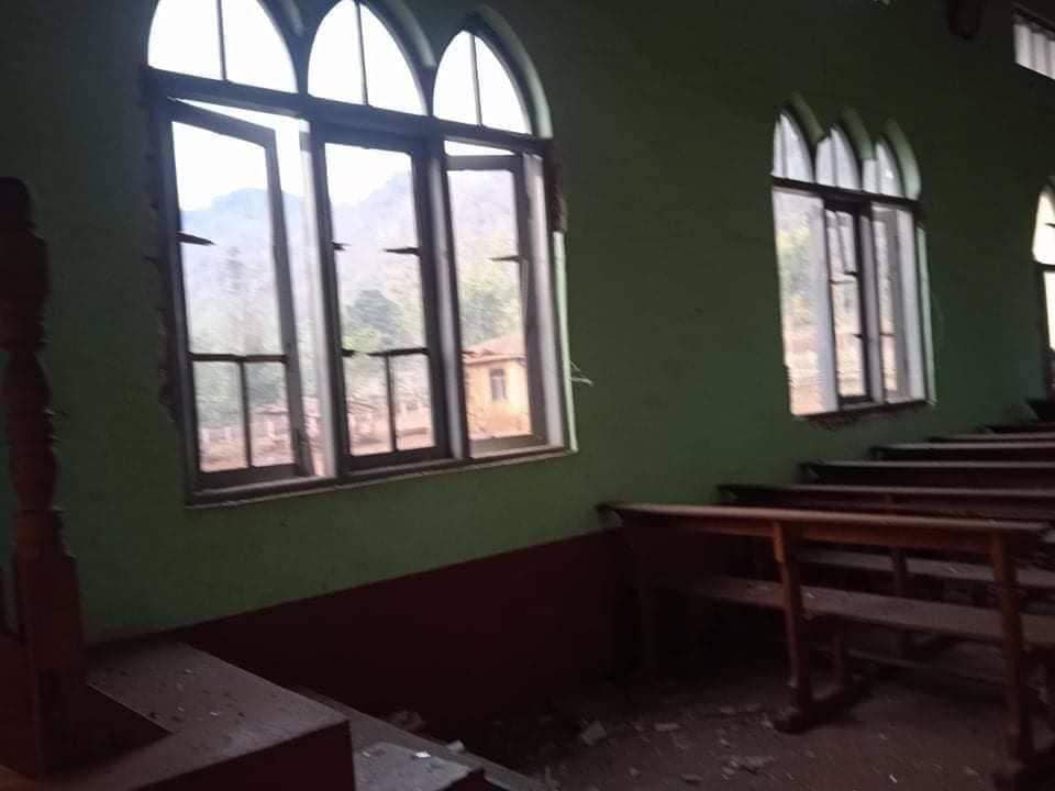 IrrawaddyNews's tweet photo. Junta aircraft bombed Saung Dula Village in Kayah State’s Demoso Township early Tuesday. Many displaced people are sheltering there, said the Karenni Nationalities Defense Force. A church and some houses were damaged in the bombings. 
(Photo: KNDF) 
#WhatsHappeningInMyanmar https://t.co/kaWUdSLPxU