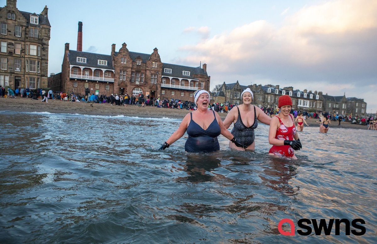 Around 700 women took a sunrise dip in the North Sea at Portobello Beach, Edinburgh for the International Women’s Day Swimrise, in aid of @EdinWomensAid , @EdinRapeCrisis &amp; <a href="/heldinourhearts/">Held In Our Hearts</a> 
#IWD22 #IWD2022 <a href="/SWNS/">SWNS.com</a>
