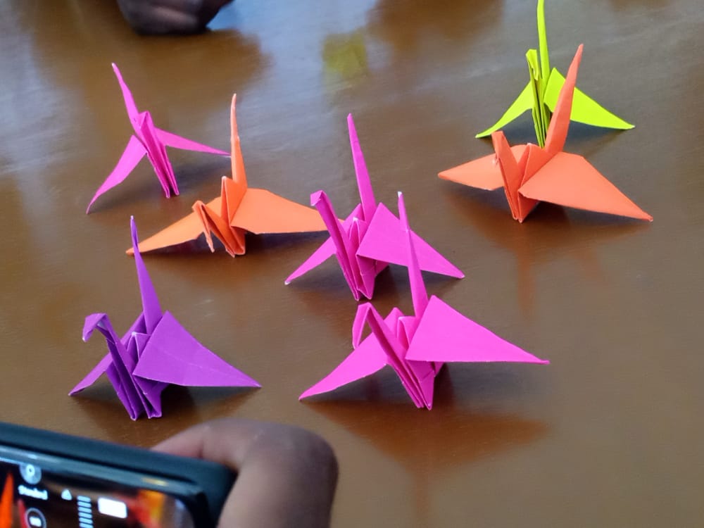 RuthMugisa's tweet photo. Since we are celebrating #WomensDay I joined @wrapcharity and @network-alive in making these😍 origamies which symblolise peace, love and hope💜 on the 7th @GlobalFund replenishment 

@GlobalFund https://t.co/vGtuq7RNxL