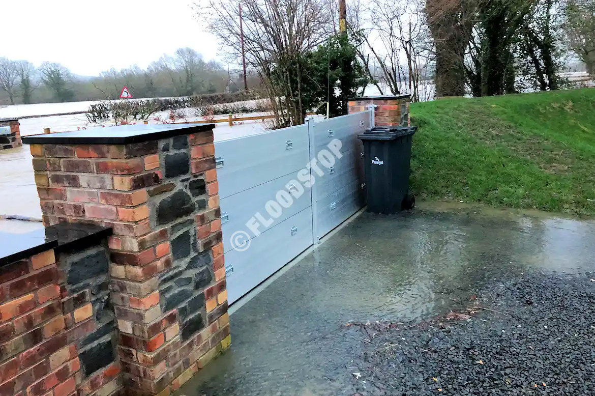 FloodstopUK's tweet photo. Storm Franklin - Feb. 2022 - Wales: Our client was very pleased to report the success of their Nautilus 400 flood barriers.  In these photos, the water is about 600mm high. The floodwater was higher than this during the night. Sadly, many neighbours lost their homes to the flood. https://t.co/1r3RUGg2Z2