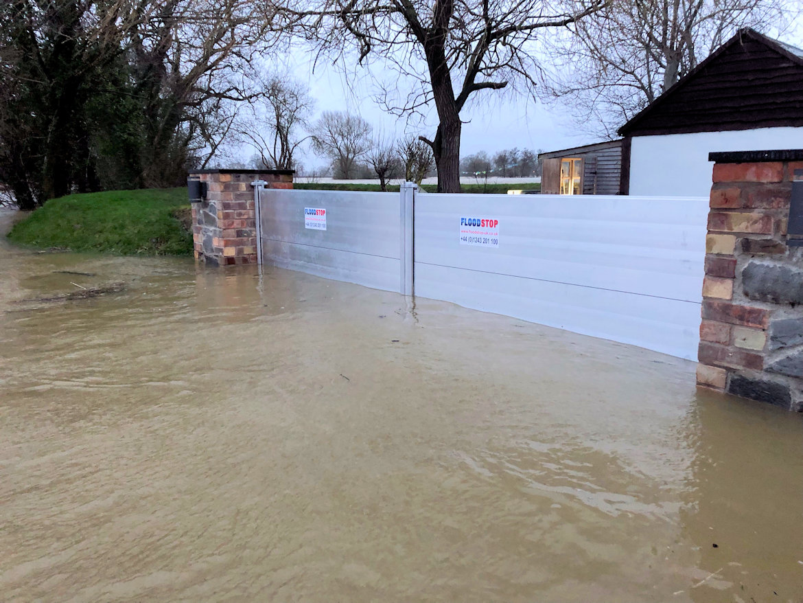 FloodstopUK's tweet photo. Storm Franklin - Feb. 2022 - Wales: Our client was very pleased to report the success of their Nautilus 400 flood barriers.  In these photos, the water is about 600mm high. The floodwater was higher than this during the night. Sadly, many neighbours lost their homes to the flood. https://t.co/1r3RUGg2Z2