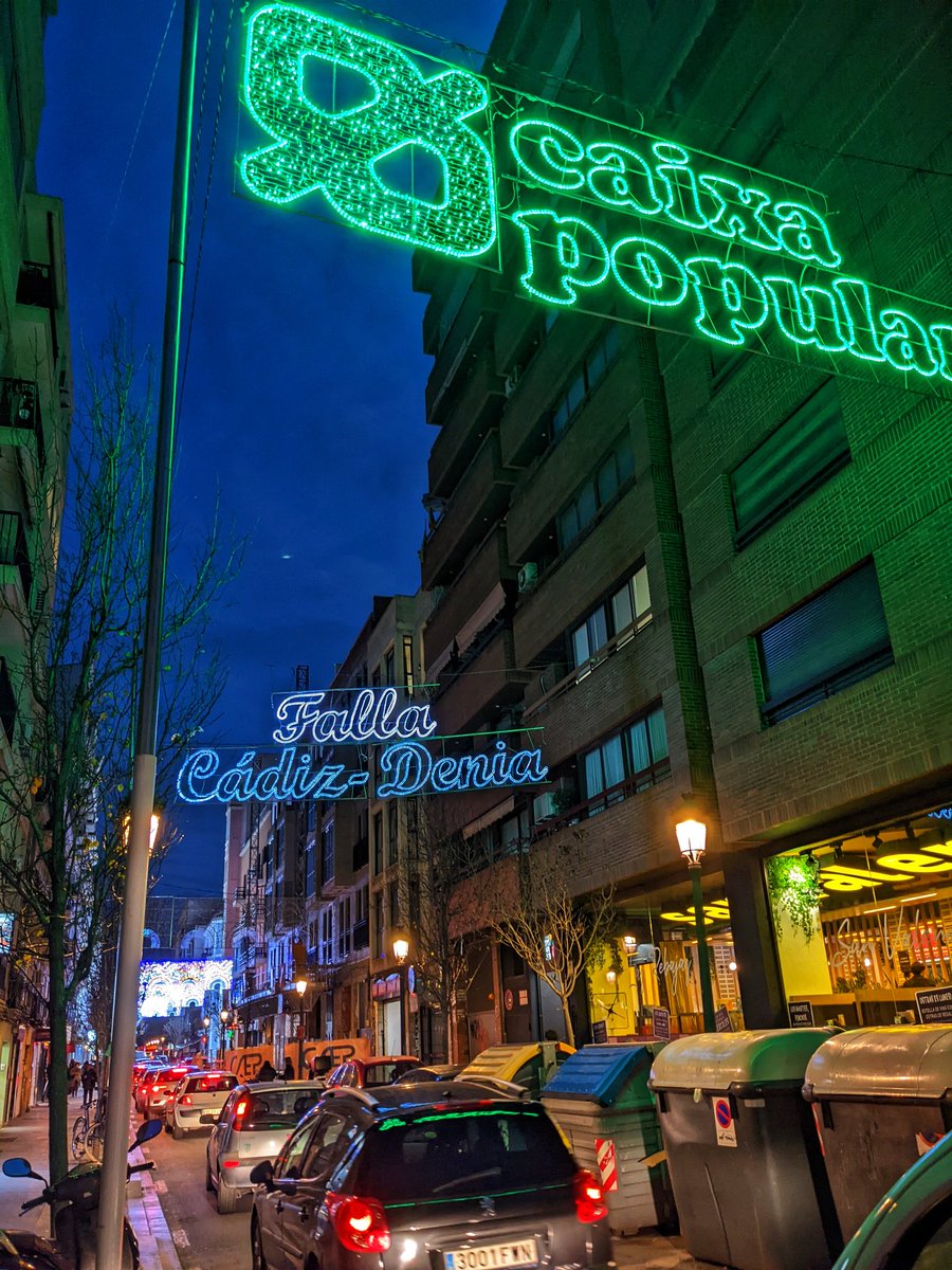 Colourful lights above the street make out the names of local Fallaa