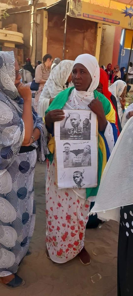 Nmhali's tweet photo. #Mar8March 

Mohamed Adam Topac’s mother was present at the march carrying a poster with his photo &amp; the words: “you are stronger than their prisons” ✊🏼💔

#Tupac is 17 yo who was falsely accused of murder &amp; tortured in prison.

#88Plus 
#FreeTupac
#SudanCoup
#KeepEyesOnSudan https://t.co/5Nz4ircKE6