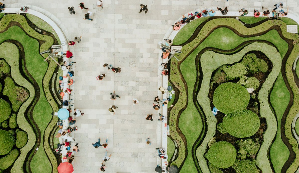 Aerial view of a public city pathway surrounded by greenery.