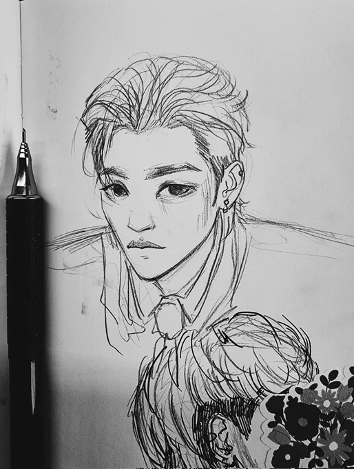 trying to figure out how to sketch hongjoong but im about to throw my sketchbook out of the window 