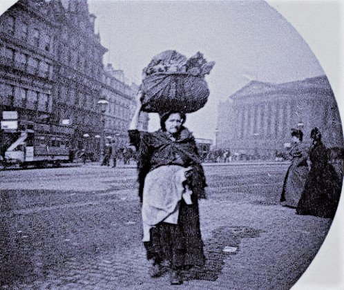 Lime Street, Liverpool c1880.  Right up until the 1960s it was common to see Liverpool women carrying bundles or baskets on their heads.  Most often it was washing being carried to and from the 'wash house'.