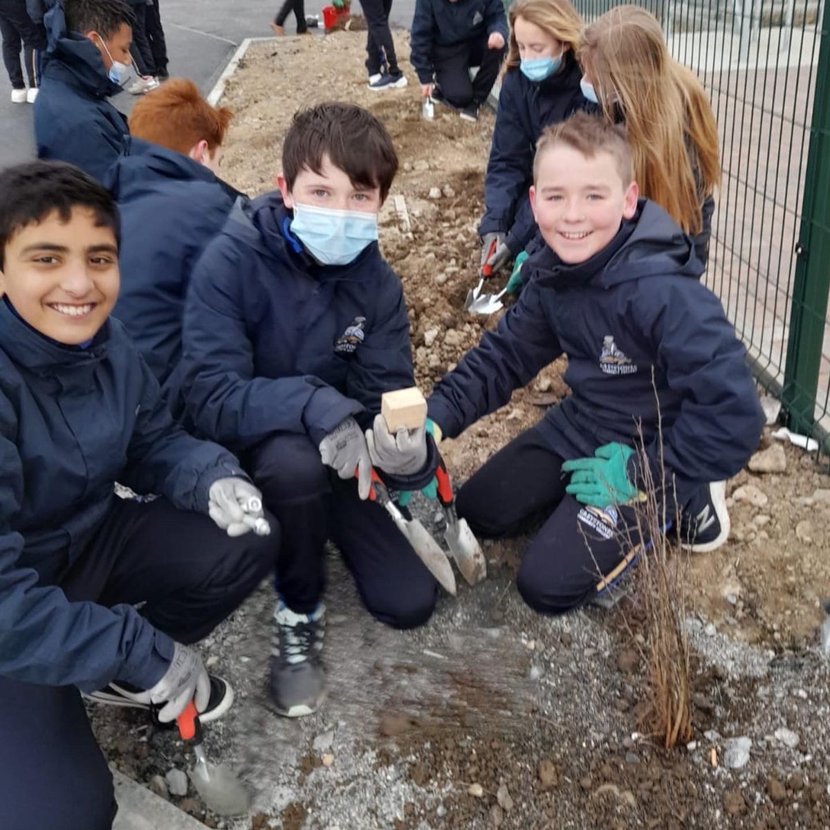 GreystonesColl's tweet photo. Well done to the 1st years who each planted a tree outside the schools new modular building on Burnaby Mill today, supported by Ms Byrne, Ms Boxall and Mr Farrell. This is part of GCCβs ongoing work to make our community more eco friendly and bio diverse. #nativeirishtrees https://t.co/9IuAxXmuDL