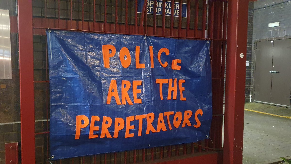 Protesters have paused outside Bridewell Police Station