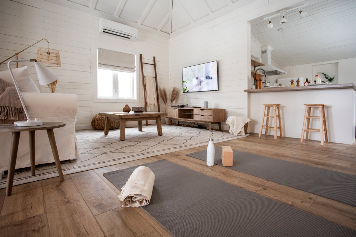The living room at The Hideaway has a tall cathedral ceiling with whitewashed board and batten walls. If you don’t want to do yoga in front of the fireplace (highly recommended!) you can always put a class on TV and follow along.