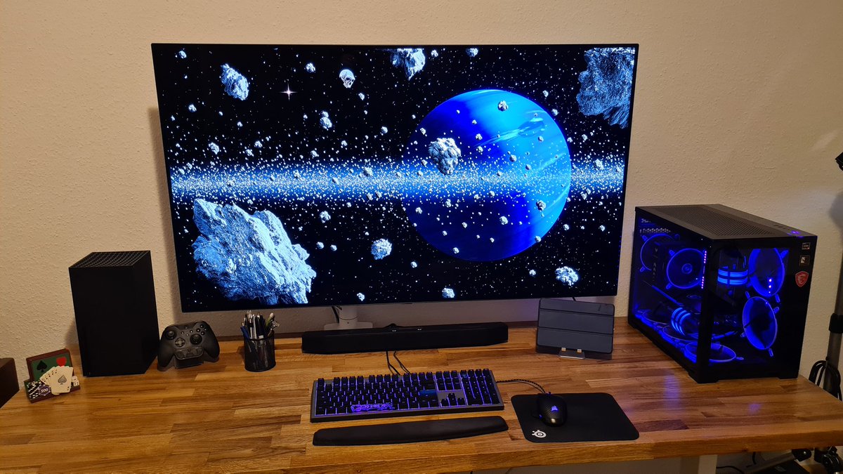 C2_driver's tweet photo. @hytebrand #HYTEupSetup  custom oak stand up desk, 55inch LG C1 OLED, XB 
Series X, PC has Ryzen 5600x, 3080ti, 10x arctic bionix fans, UV lighting. Monochrome Y60 soon! https://t.co/KG3T1RUc2D