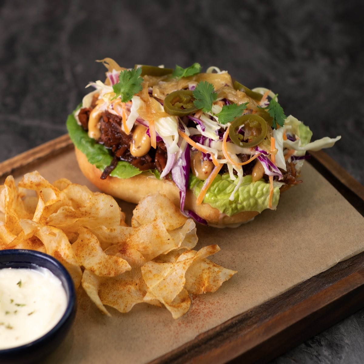 Hump day eats!

Introducing Lunaxy’s Open-Face Pulled Pork Sandwich.

Shredded homemade lechon belly with barbecue sauce, topped with chipotle aioli, coleslaw, caramelized onions, jalapeños and cilantro on top of a homemade brioche served with cassava chips on the side.
