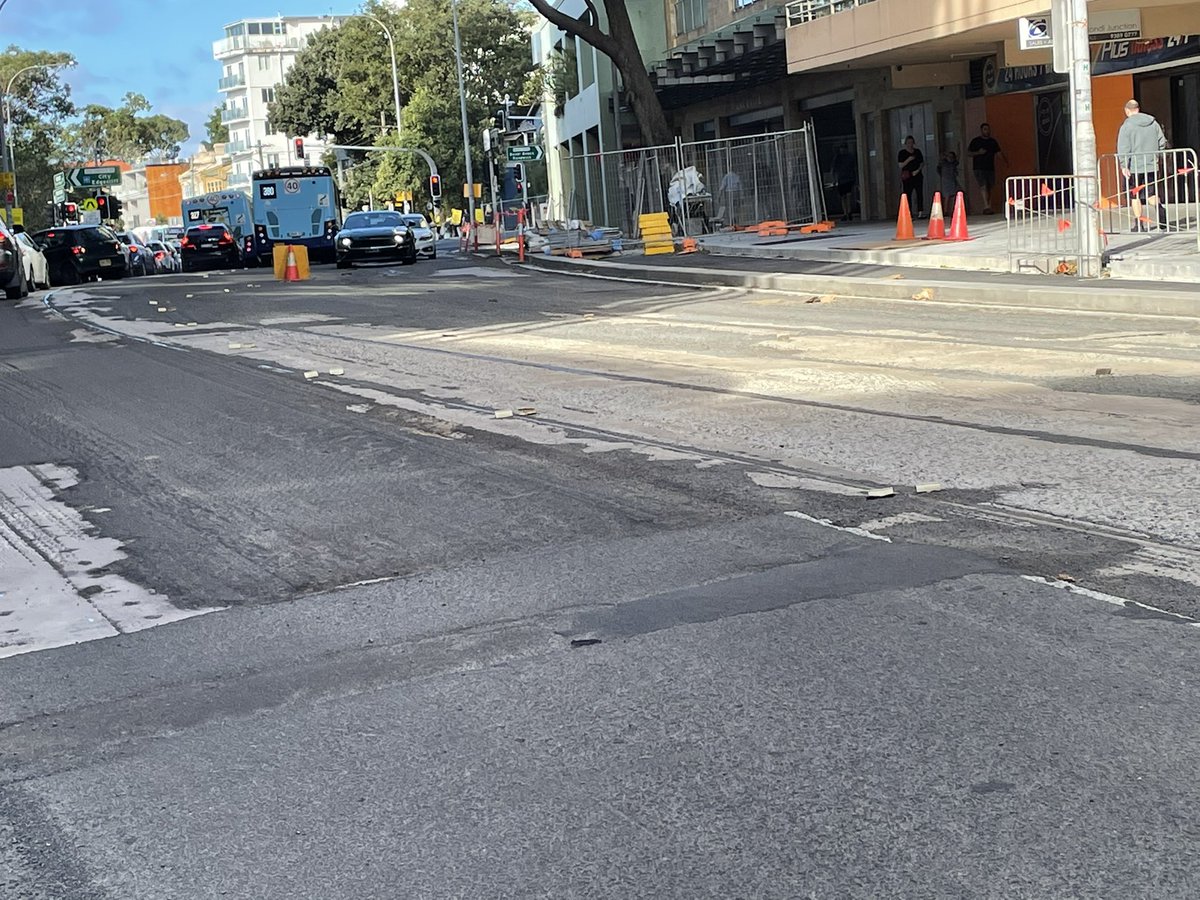 bambul's tweet photo. Road works in Bondi Junction have revealed what looks like the old tram tracks on Oxford St. It’s been hard to take a close look with all the weather, but I’m pretty sure that’s what they are. A rare sight. https://t.co/PIkS2a1US3