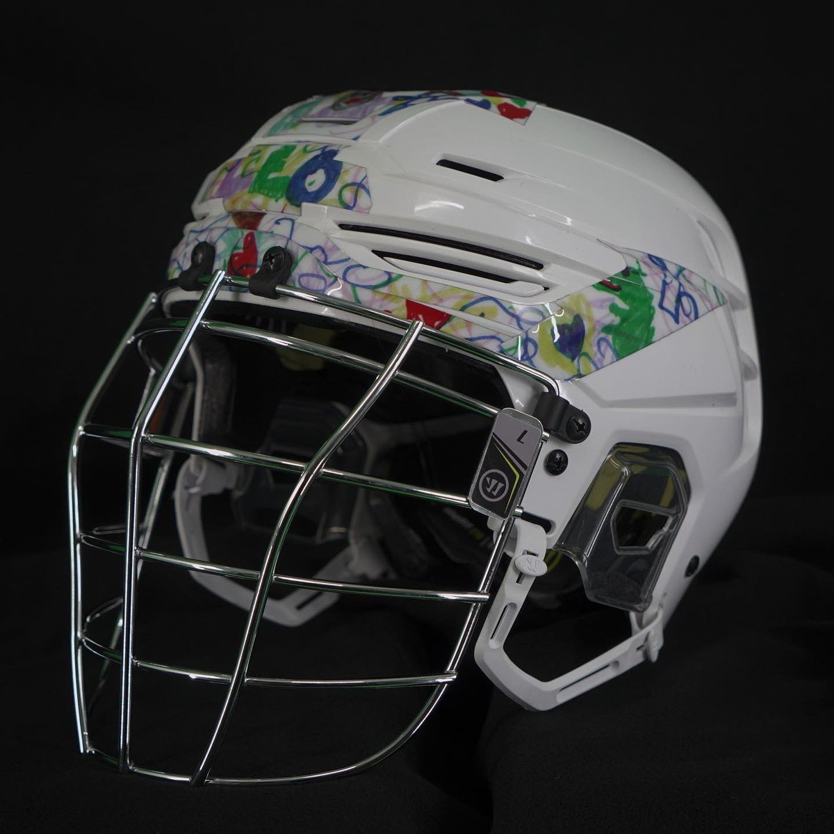 SealsLax's tweet photo. Our players will wear helmets this weekend with special decals designed by children with Down syndrome part of Down Syndrome Awareness Night 💜

All helmets &amp; some special pieces are now available for auction via the @DASHauction app. Download the app today to place your bids! https://t.co/HysP0PvCO0