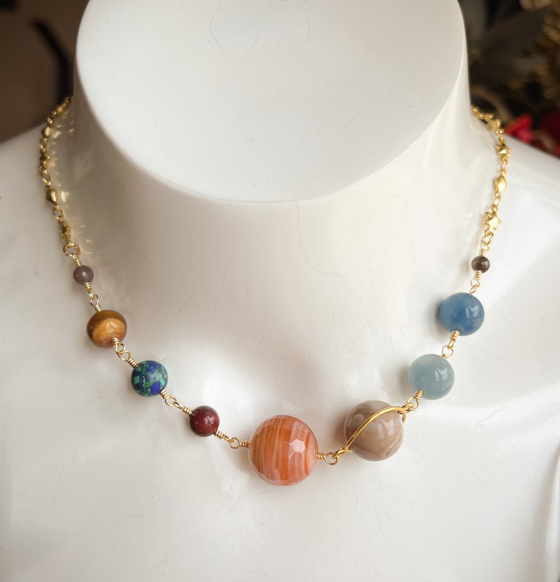 went to a gem show a few weeks ago where my bestie and i hand picked a ton of gemstone beads that resembled all of the planets in the solar system so i present to u…….. 
my first solar system soup necklace🪐