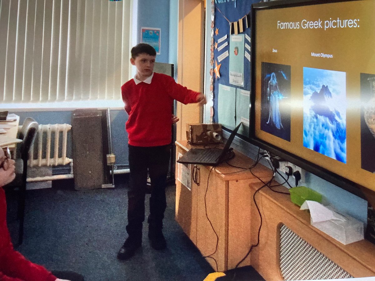 MrsCobley11's tweet photo. This young man shared his Ancient Greeks home learning with us today. He’d created a fabulous PowerPoint of facts on our topic. He was really confident presenting his work so was awarded extra house points. @RedscopeSchool https://t.co/iBBULFMsWy