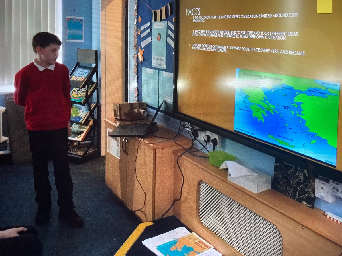 MrsCobley11's tweet photo. This young man shared his Ancient Greeks home learning with us today. He’d created a fabulous PowerPoint of facts on our topic. He was really confident presenting his work so was awarded extra house points. @RedscopeSchool https://t.co/iBBULFMsWy