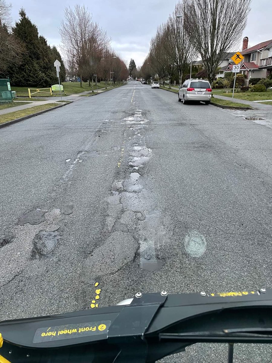 canadagirl16's tweet photo. @CityofVancouver how many potholes are too many? Driving on Muirfield Dr in E Van is horrible... Patching can only do so much. https://t.co/lnNzOp230A