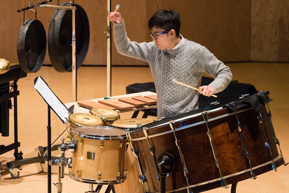 A person playing percussion instruments