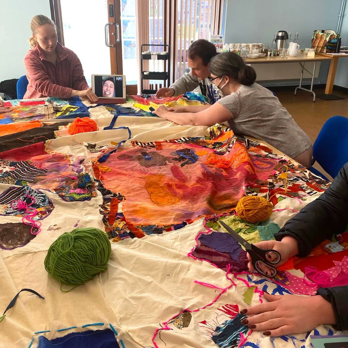 Suffolk_Artlink's tweet photo. Brave art started back after half term with an explosion of colour! The Lowestoft team spent the day around a big table sewing 'One World'. They also learnt how to say Goodbye in Arabic as Ellie, one of our support team, is originally from Egypt #Welcomeback #Braveart #Suffolk https://t.co/gxUnBr0NMk