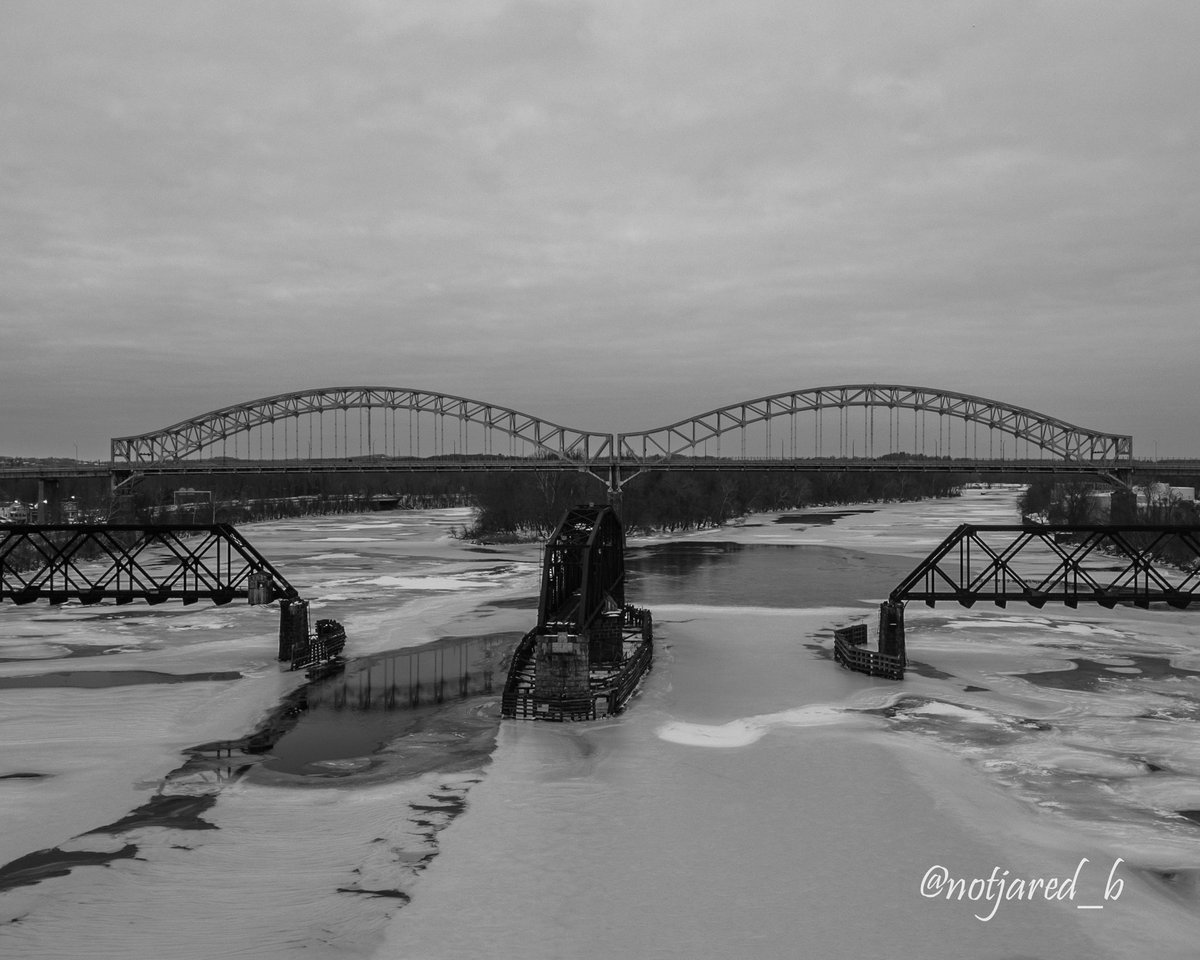 notjared_b's tweet image. #marchreflectionchallenge a peek of the reflection of the bridge between the ice on the river.