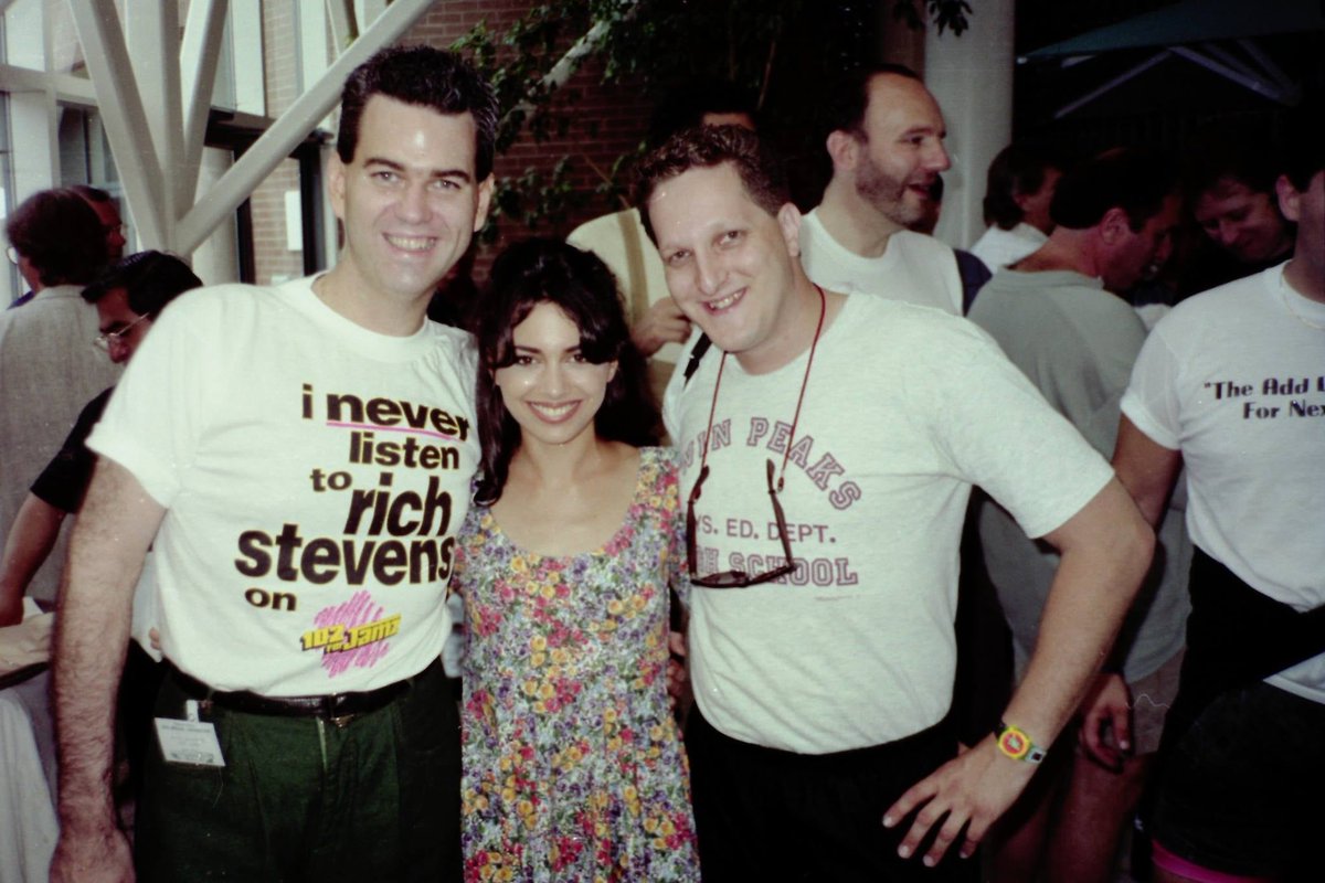 PopMusicSurvey's tweet photo. From the Golden Age of Bobby Poe's Pop Music Survey, here's a picture from the 1991 Poe Convention featuring @SusannaHoffs with attendees Rich Stevens and Craig Rosenberg. The @ColumbiaRecords promo team brought Susanna in to promote her debut solo single "My Side Of The Bed"! https://t.co/Xeqj5JvKGW