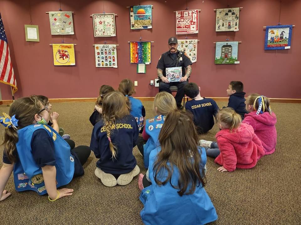 HanoverFire's tweet photo. FF Eric Johnson took some time out of his day yesterday to be a guest story reader at the International Women's Day story and craft time event in the John Curtis Library.  Hanover FF’s love investing in our youth, and take every possibility to teach them fire safety &amp; education. https://t.co/mUMjv5LT16