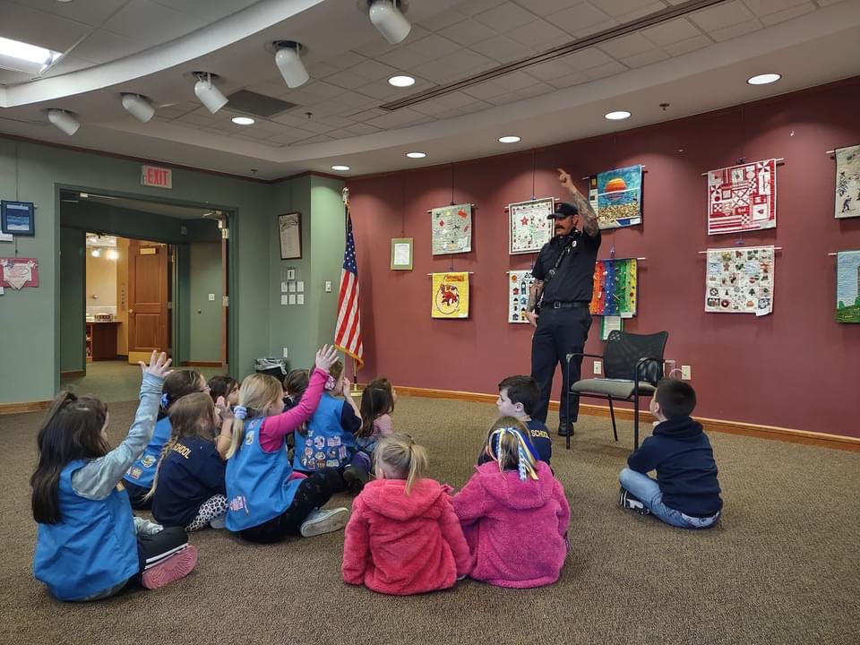 HanoverFire's tweet photo. FF Eric Johnson took some time out of his day yesterday to be a guest story reader at the International Women's Day story and craft time event in the John Curtis Library.  Hanover FF’s love investing in our youth, and take every possibility to teach them fire safety &amp; education. https://t.co/mUMjv5LT16