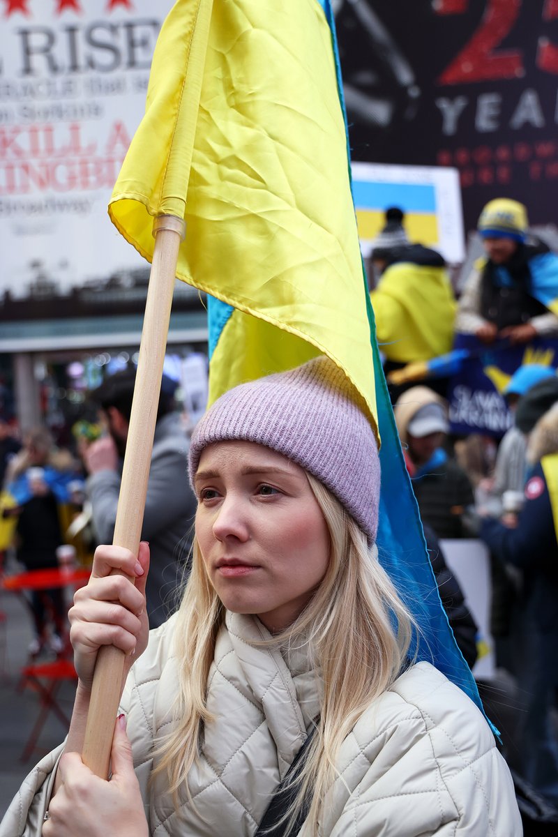 adamstoltman's tweet photo. Some of the faces at the Stand with Ukraine rally in Times Square last weekend.  So much empathy for what the Ukrainians are enduring, and so bravely combatting. https://t.co/2RU6AogPPQ