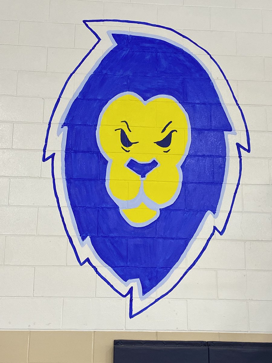 HUGE thanks to one of our fine retired RCCDSB EAs Maggie Kelly, for painting our new Lourdes Lions Logo on our gym wall today. Kids are pumped for their new mascot! Congratulations again to Joseph, Ivy and Henry Gagnon for their mascot design!