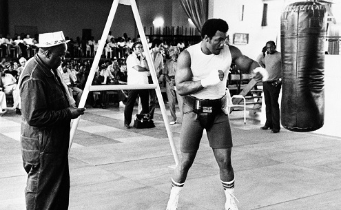 Heavyweight History on X: World champ George Foreman works the heavy bag in Zaire, #Africa before his showdown with Muhammad Ali in 1974, the famous Rumble in the Jungle. Trainer Dick Sadler Heavyweight History on X: World champ George Foreman works the heavy bag in Zaire, #Africa before his showdown with Muhammad Ali in 1974, the famous Rumble in the Jungle. Trainer Dick Sadler