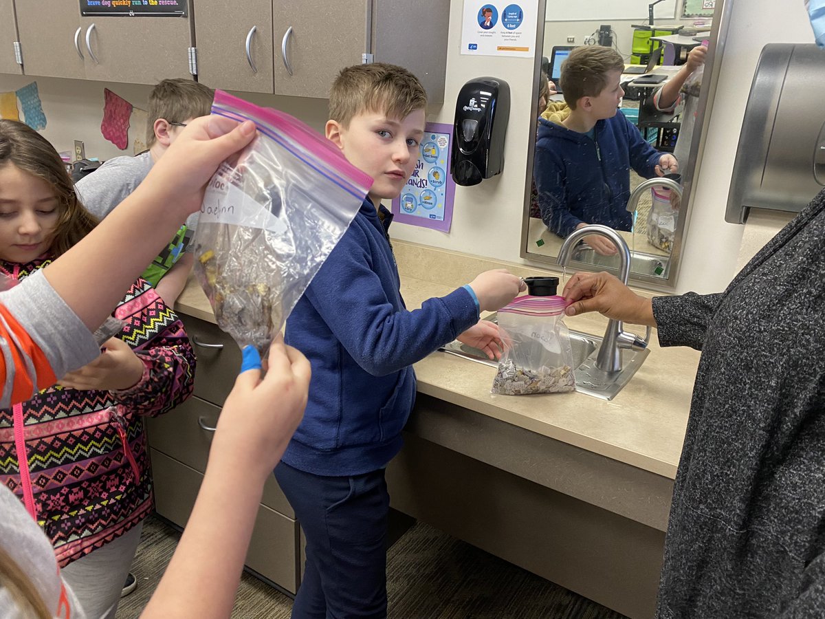 banders85's tweet photo. Taking questions during a class discussion on rock layers put to a hands on opportunity! (Plus a bonus 2nd grade small group.) Hey there mini compost bags, break it down! @PatriotsWalnut #4thgrade #compost  #studentgarden #foodwaste https://t.co/Pd3kRSOY05