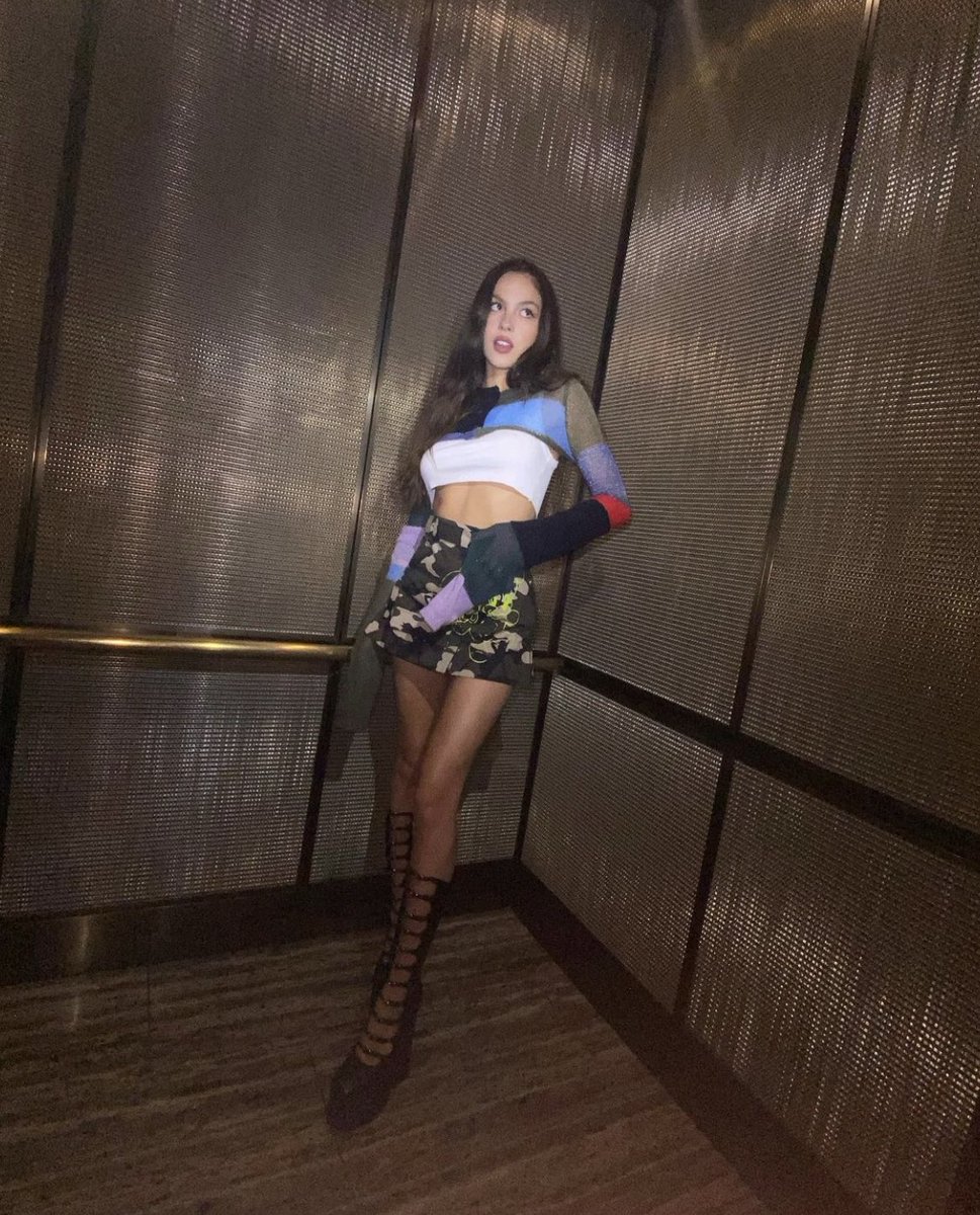 chambierigo's tweet photo. olivia rodrigo and emma chamberlain in the heaven by marc jacobs miniature striped cardigan https://t.co/ar9LMartib