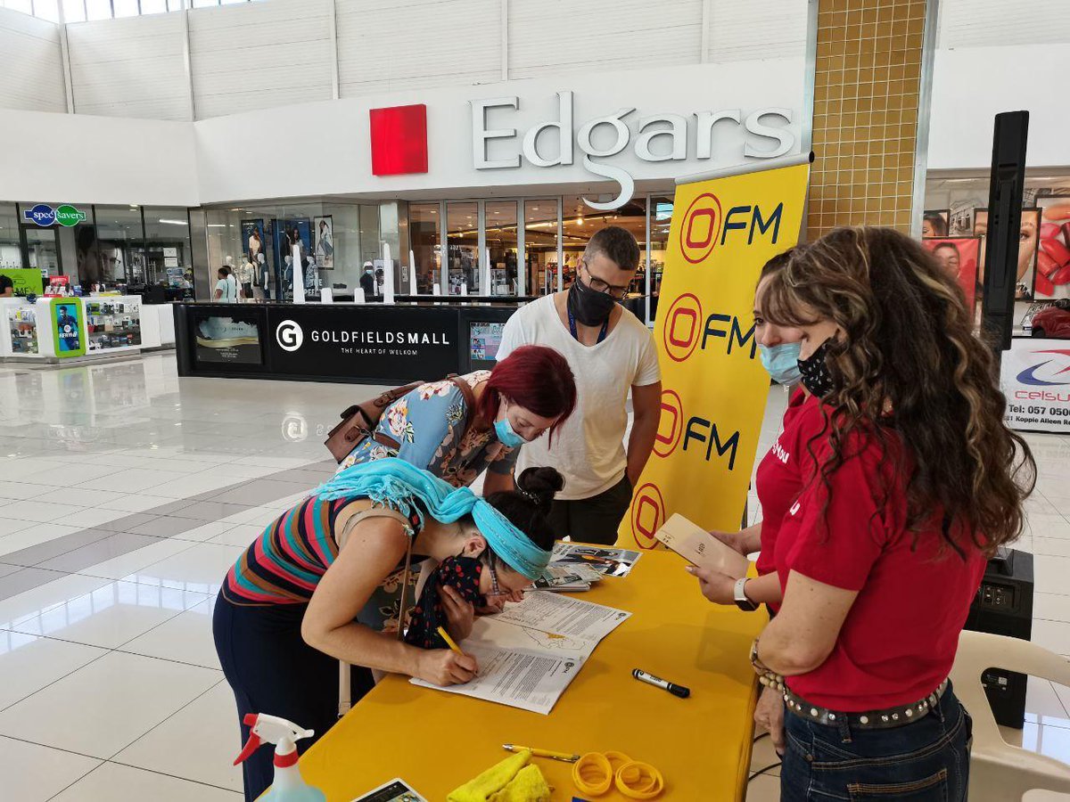 OFMNuus's tweet photo. The #OFMFanWall βAll O-ver Central SAβ road trip has stopped over in Welkom! At Lunch is live from Goldfields Mall until 15:00 today. Have your OFM Fan Wall photo taken and you stand a chance to win the R1000 spot prize! Full details here: https://t.co/5Otwc7ECdc https://t.co/Q5SEVu5WWo