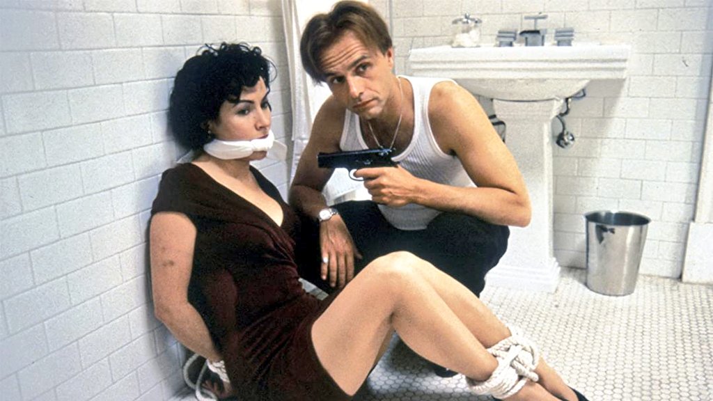 #Bales2022FilmChallenge

11 March - Plumber Seen in Movie

'Corky' is a beautiful boyish handywoman working on apartment renovations in thriller 'Bound' (1996). Ironically, she's good with plumbing problems. A seductive mobster's girlfriend, next door, taps into that skillset.
