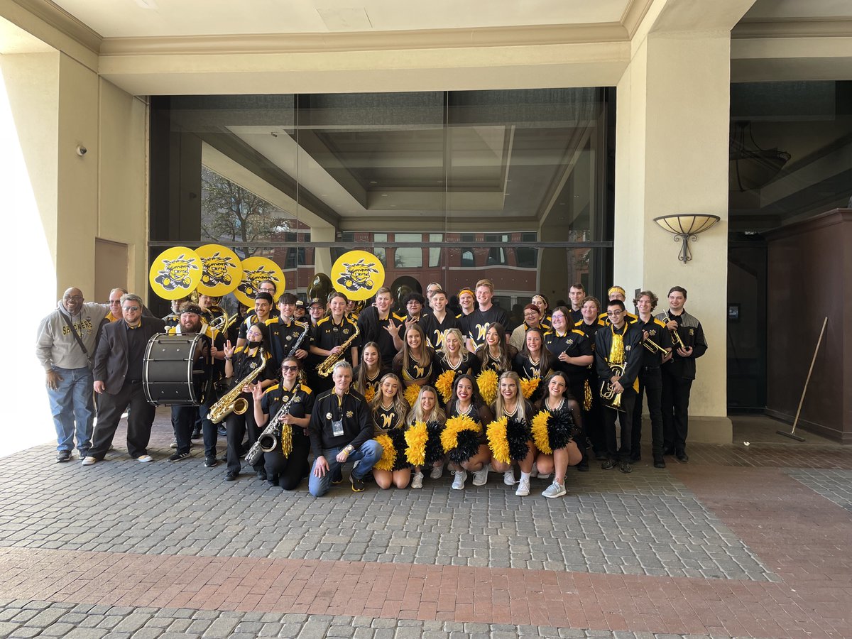 PresidentWSU's tweet photo. Hanging out with @GoShockersSound and @GoShockersCheer getting ready for the @goshockersmbb game down in Ft. Worth! Go Shockers! 🎺 🏀 #watchus https://t.co/W0DvDbgpZy