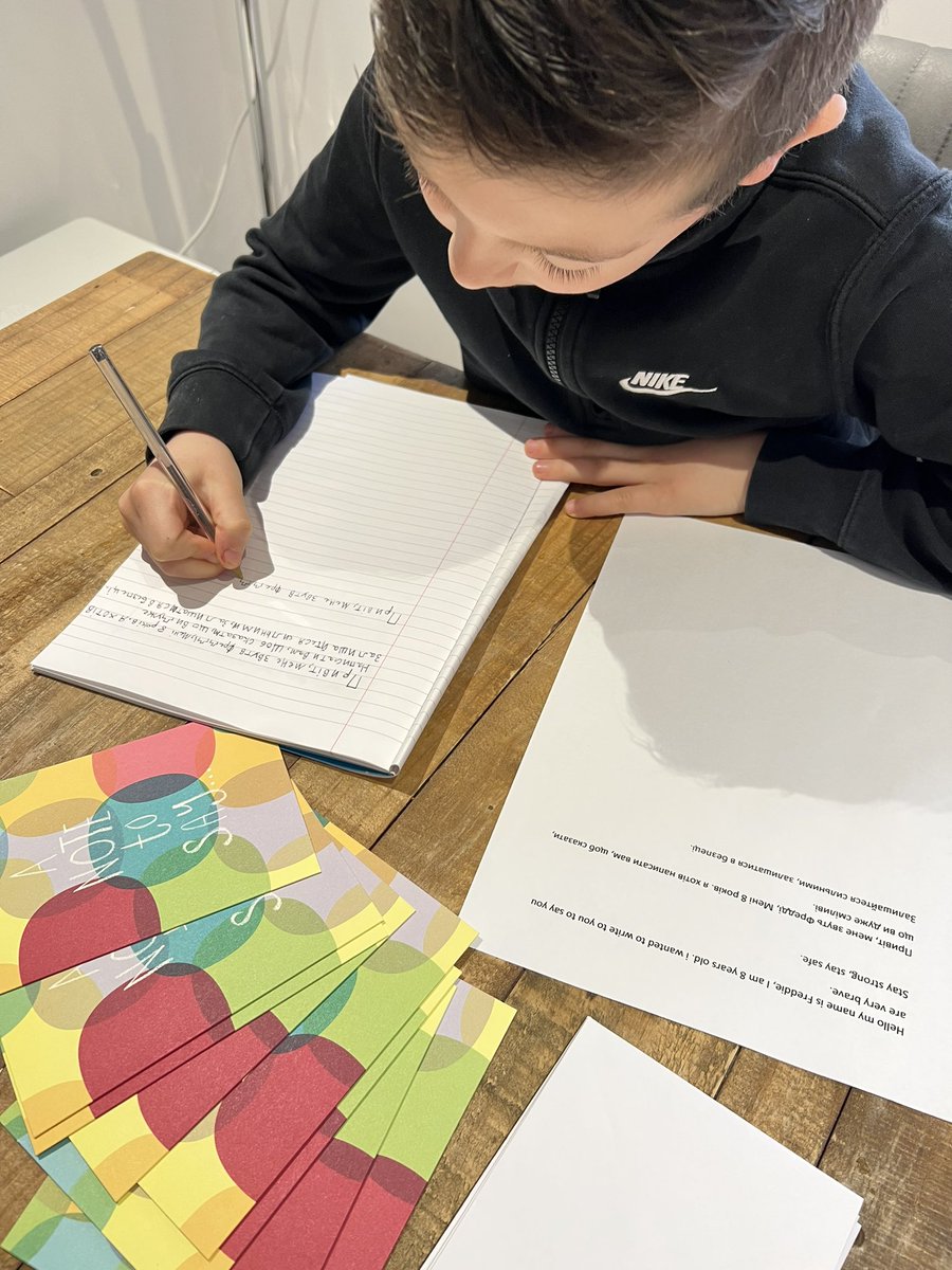 Charlottie23's tweet photo. Super proud of Freddie writting notes in Ukrainian to send to some of the children. 💙🇺🇦💛 #ukrainwar #childrenofukraine #proud https://t.co/Kbdf2pTZ92