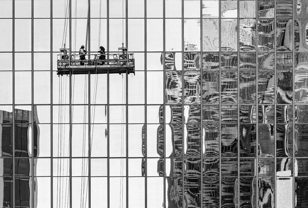 dsidaway's tweet photo. Lots of ongoing construction in Montreal including these two guys adding trim around the windows of the new headquarters of the Banque Nationale du Canada. #montreal #bnw_quebec #construction #bnw_magazine https://t.co/arDYS9EaTL https://t.co/0bZGwKlHjs
