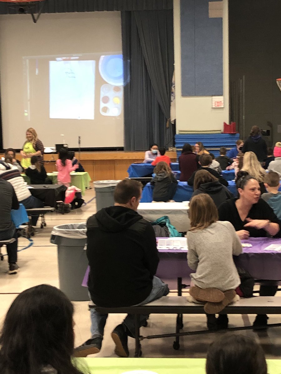 Paint 🎨 Night at Erickson!  Mrs. Clay is leading families in painting our school mascot, an 🦅 Eagle.  So much fun!