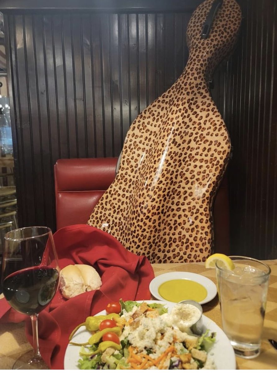 playinglesshurt's tweet photo. My dinner companion. He doesn’t eat much! On airplanes he doesn’t cry.  #cello #cellistlife #music https://t.co/b7O4ImUzug