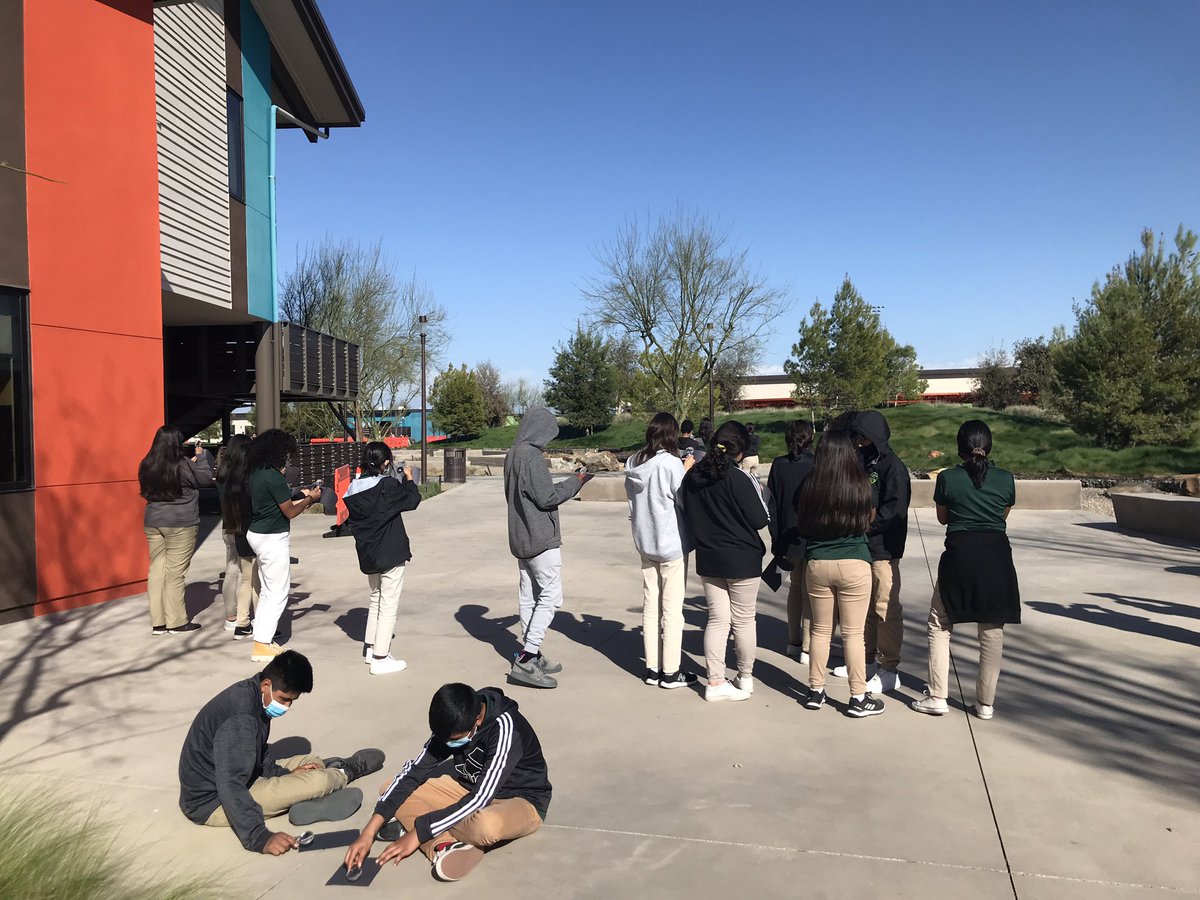 AllieBBogart's tweet photo. Our phenomenon is Excessive Heat in the Central Valley, so we begin by investigating light from the sun. We can burn paper with sunlight, but not light from a lightbulb….does sunlight have something special that our classroom lights don’t? #ngss #stemscholar #cangss https://t.co/0cif6rVaJJ