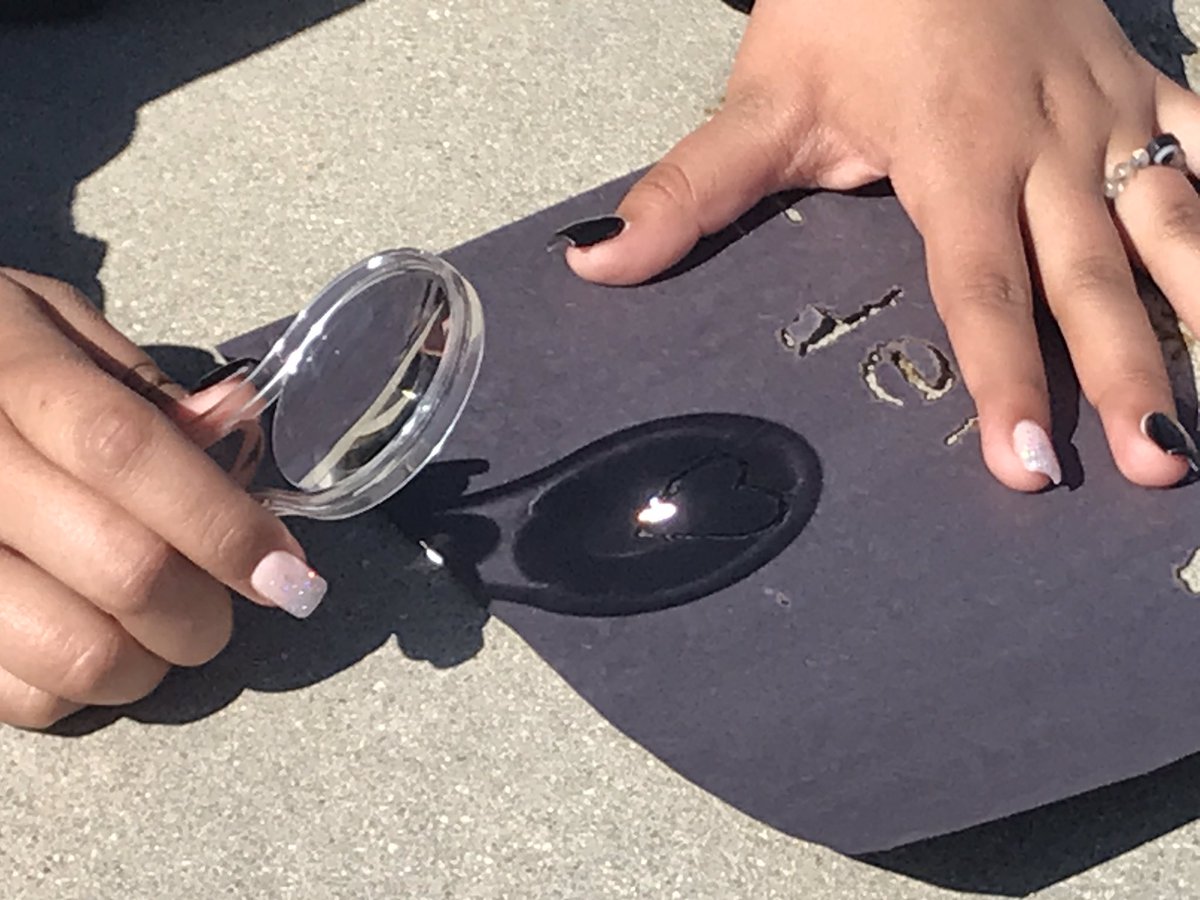 AllieBBogart's tweet photo. Our phenomenon is Excessive Heat in the Central Valley, so we begin by investigating light from the sun. We can burn paper with sunlight, but not light from a lightbulb….does sunlight have something special that our classroom lights don’t? #ngss #stemscholar #cangss https://t.co/0cif6rVaJJ
