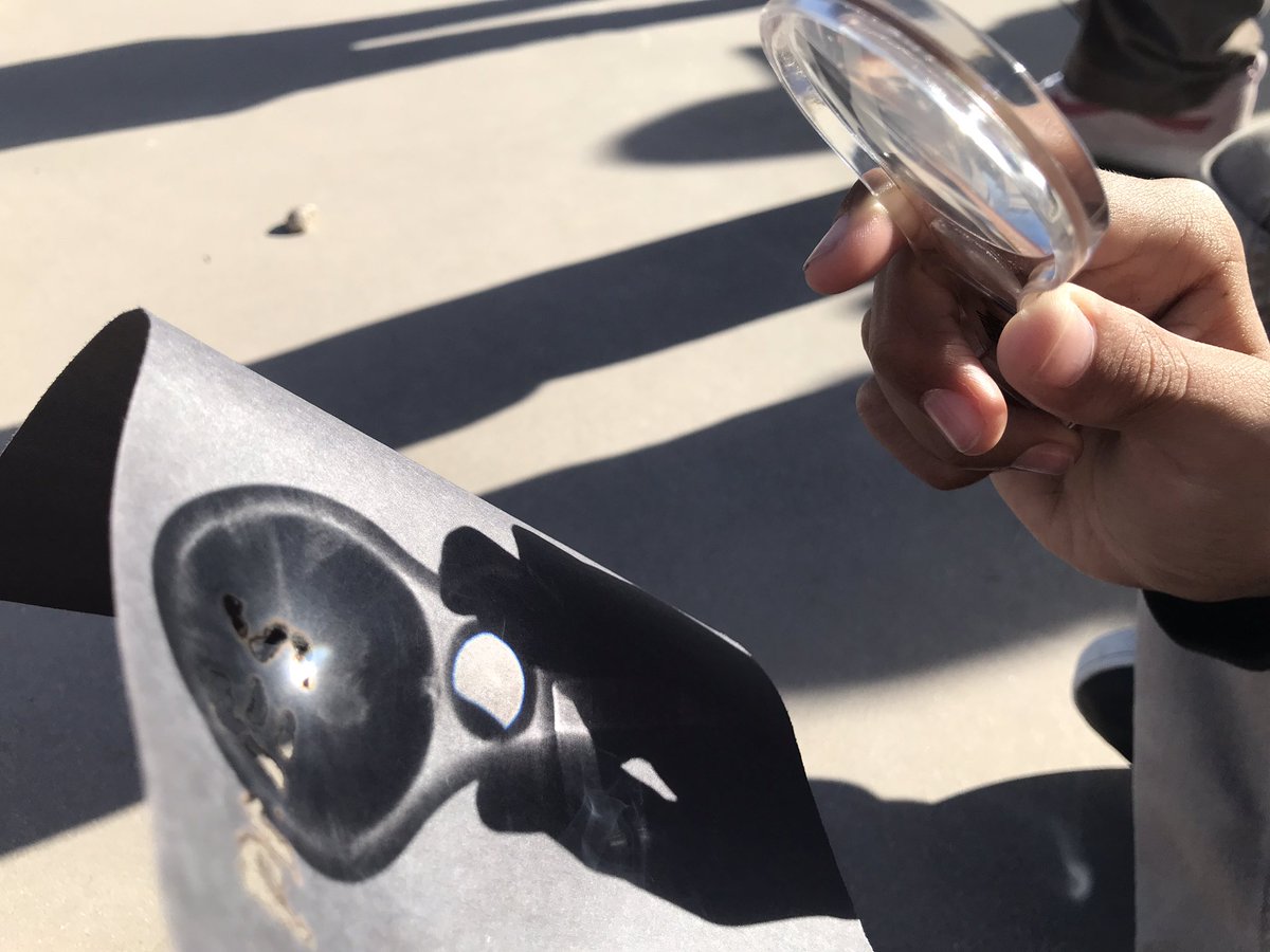 AllieBBogart's tweet photo. Our phenomenon is Excessive Heat in the Central Valley, so we begin by investigating light from the sun. We can burn paper with sunlight, but not light from a lightbulb….does sunlight have something special that our classroom lights don’t? #ngss #stemscholar #cangss https://t.co/0cif6rVaJJ