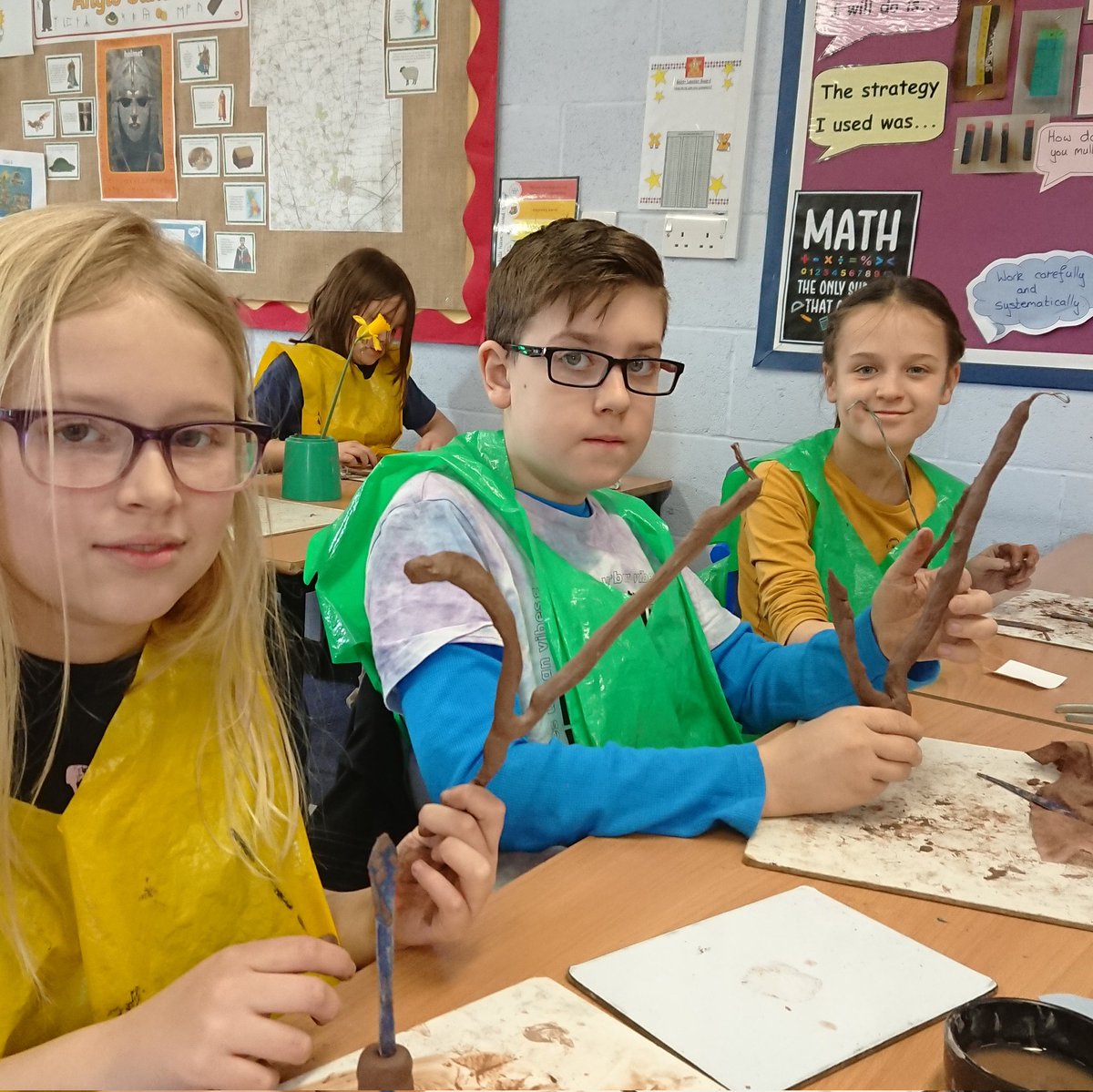 Foxes have made metal frames. Now we are covering the frames to create a class bunch of clay daffodils. Very Spring! 🦊 💐