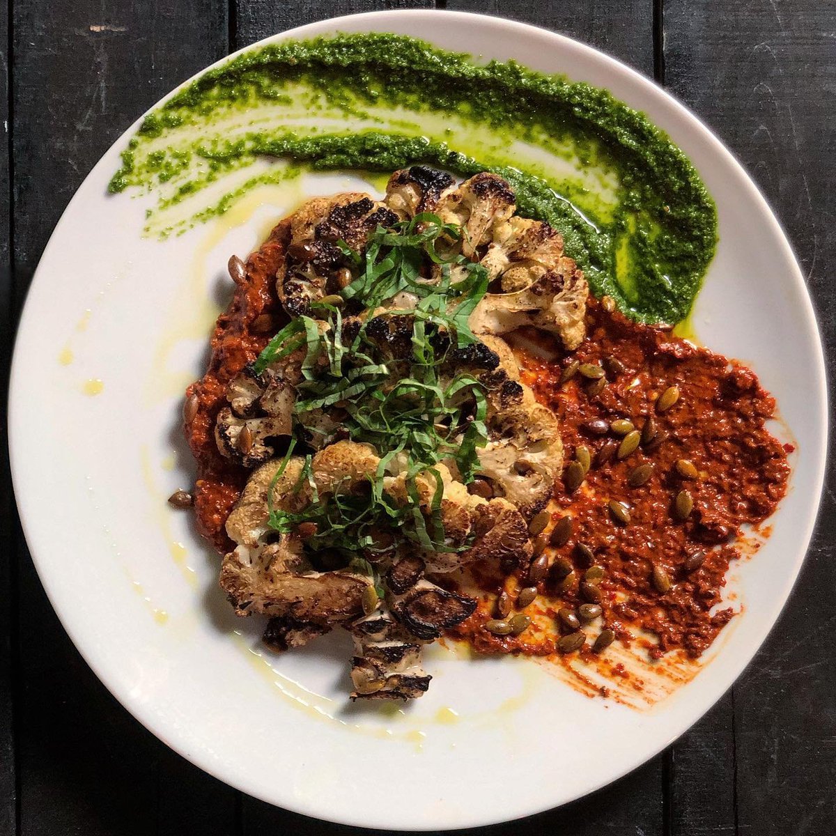 NudeDudeFood's tweet photo. Cauliflower steaks, Romesco, Salsa Verde, Pepitas, Olive Oil. 
TGIF. https://t.co/cU7lgCm0zq