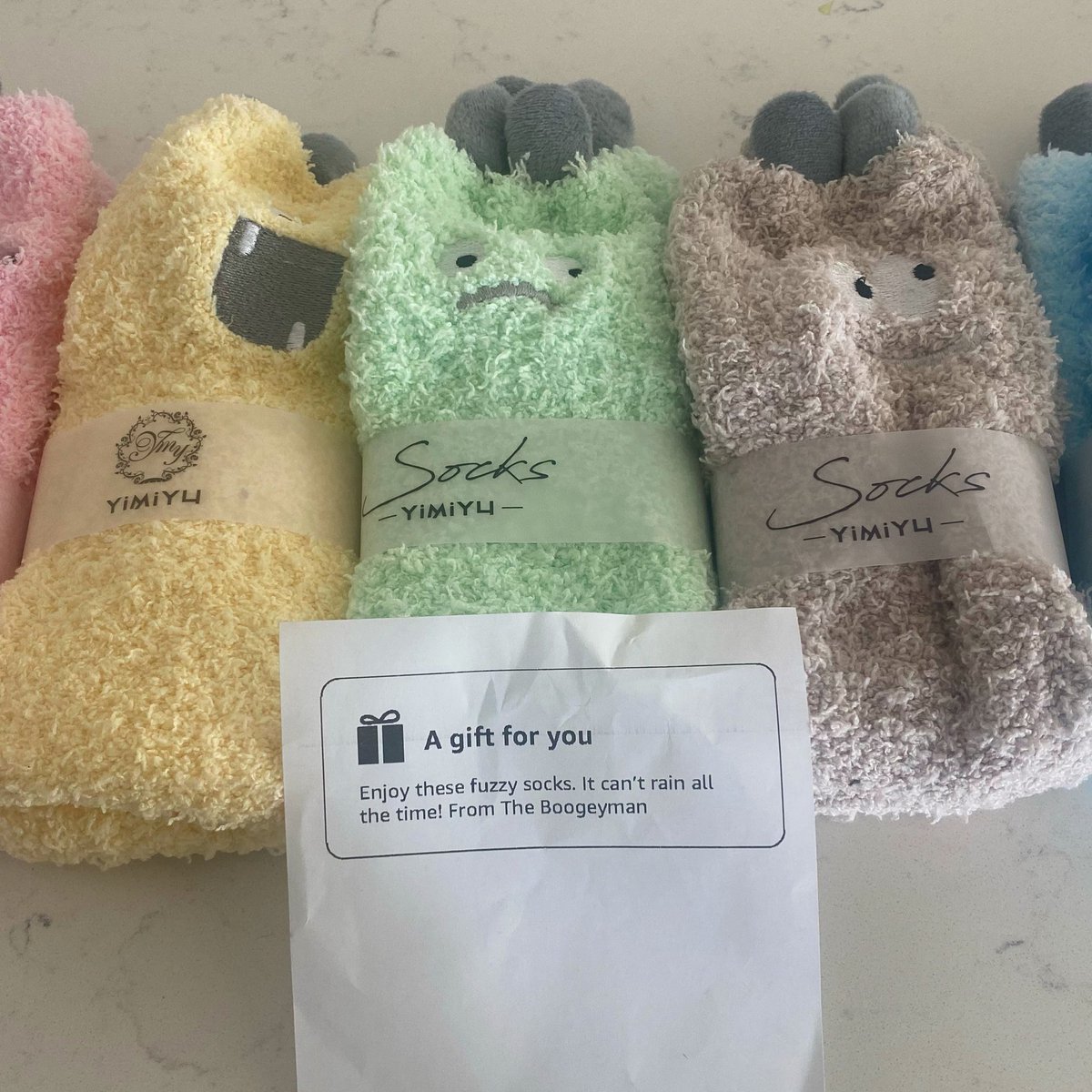 April_Slaughter's tweet photo. When your relationship with the #Boogeyman is so tight, he sends you cozy fuzzy monster socks to cheer you up. Thanks, Boogeyman. Love, #ScaryLady! 🖤 https://t.co/FQKk5yvyfJ